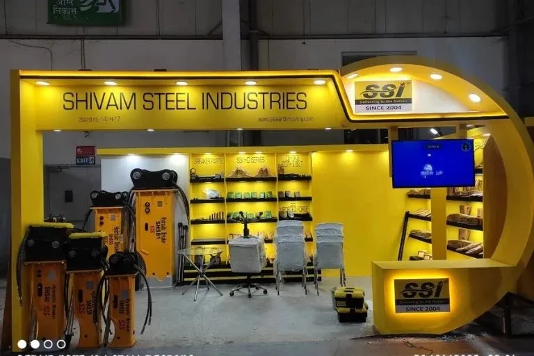 Exhibition stand structure, lighting and branded graphics being installed in Hannover