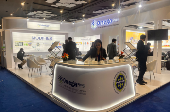 Omega Parts display booth with interactive setup for showcasing plastic processing equipment at PaintIndia 2025, Pune