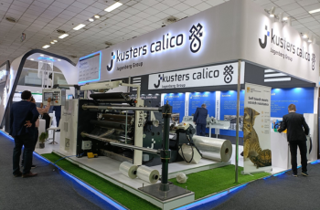 Kusters Calico booth displaying advanced machinery for plastic processing and manufacturing at PaintIndia 2025, Pune